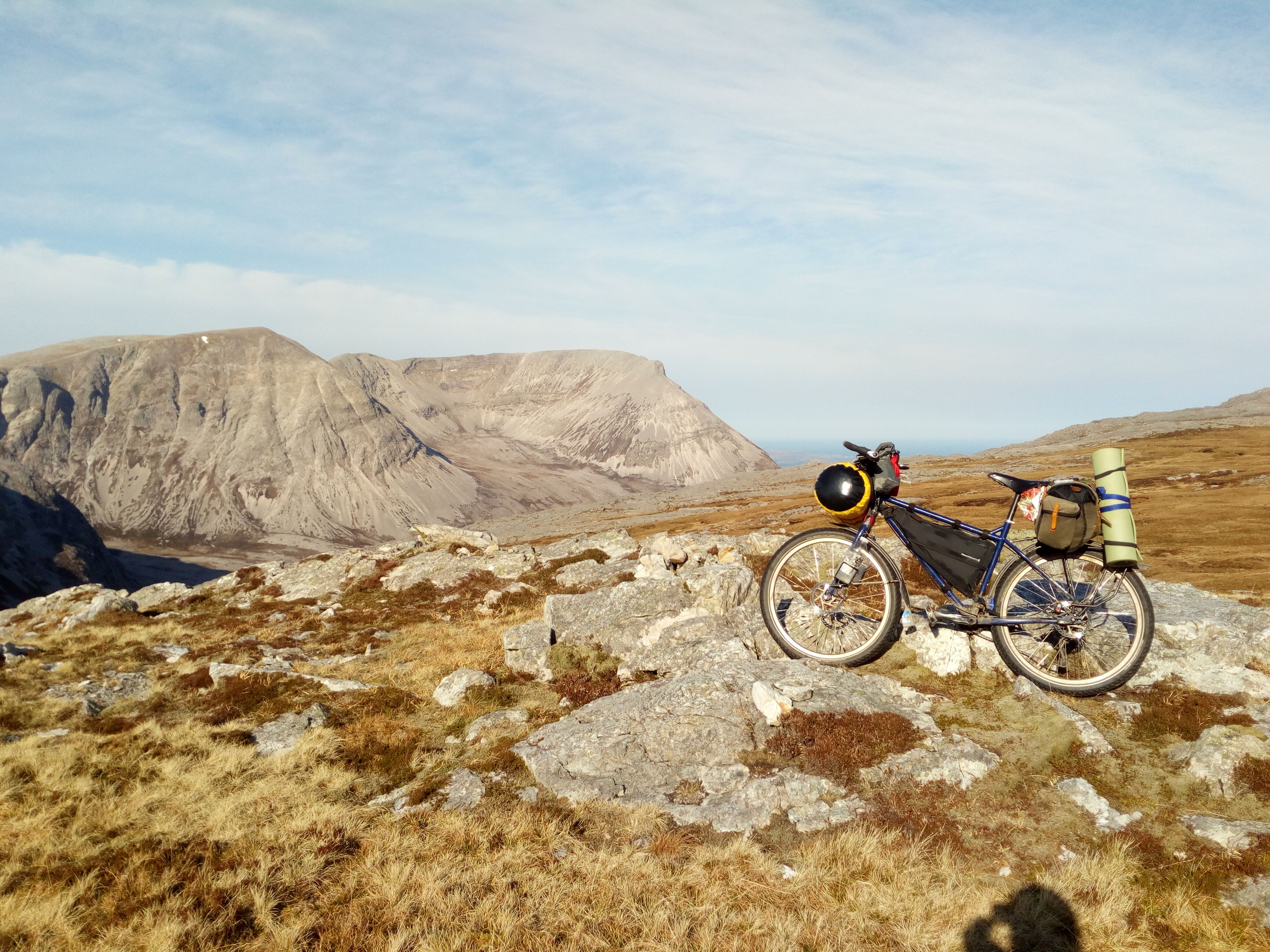 Bike with a saddle bag with mountains in the background