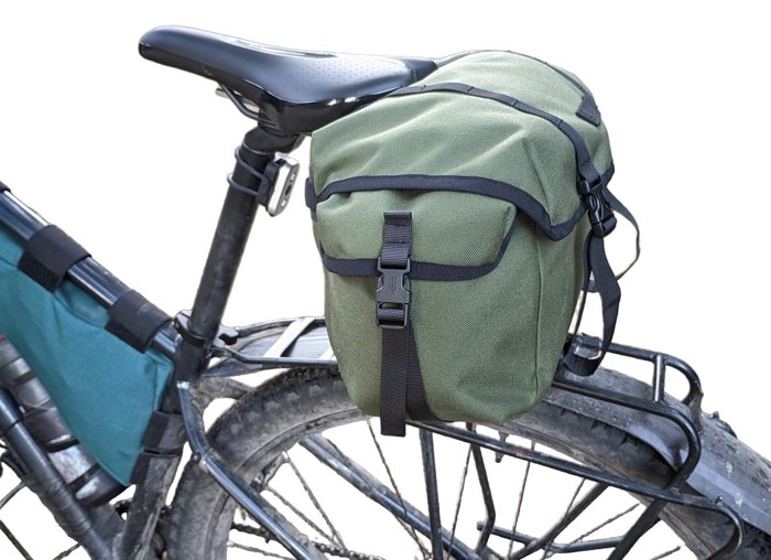 Saddlebag attached to the saddle on a pannier rack