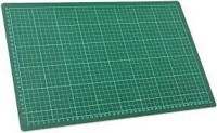 A large green self-healing cutting mat.
