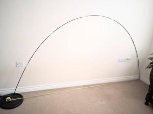 Photo of bent tent pole in a room