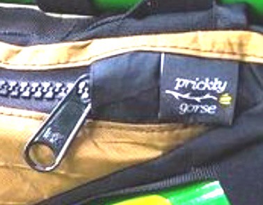 Zipper garage, a flap of fabric the zip sits behind.